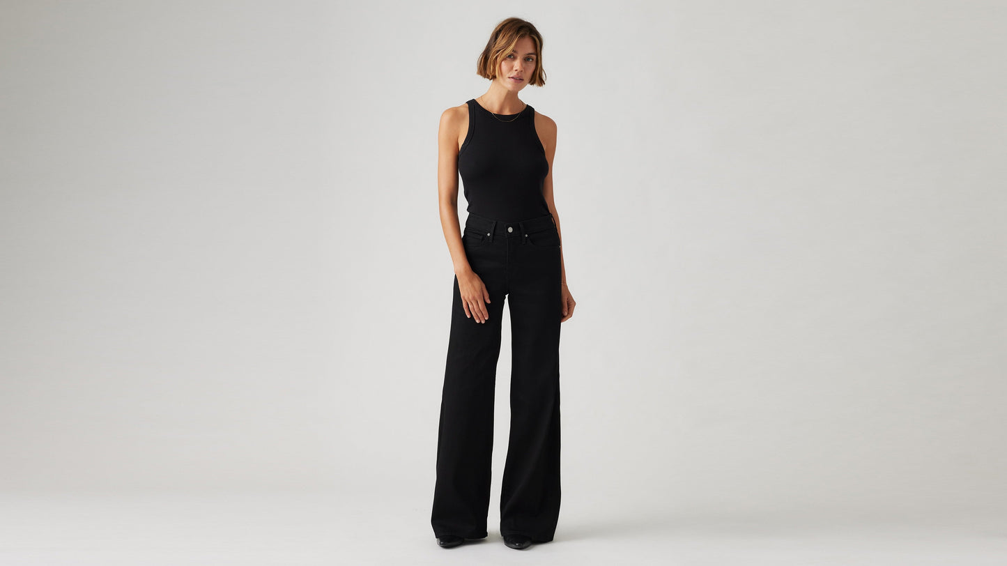 Levi's women's black jeans on model, side view