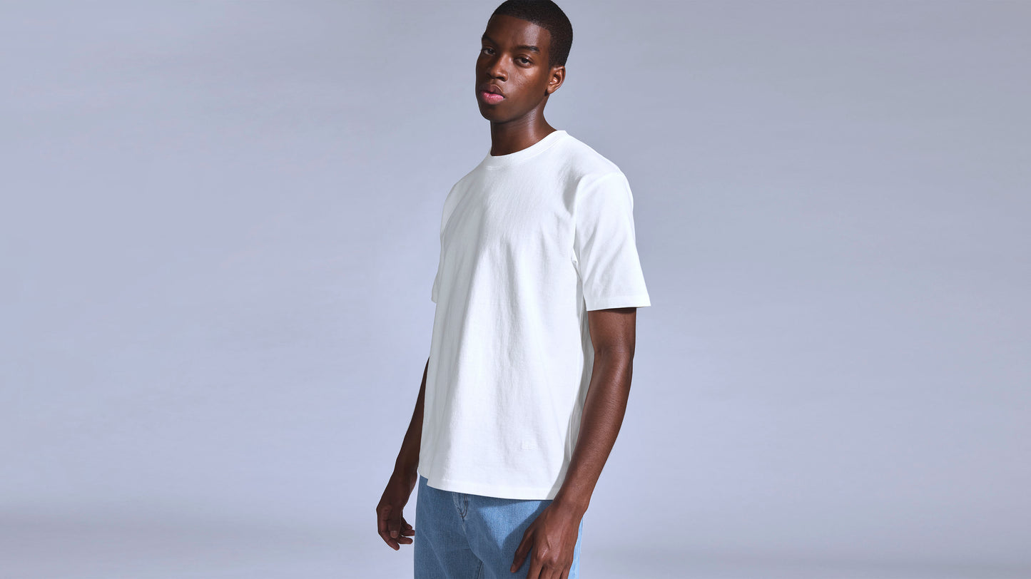 Model wearing Levi's white shirt and light blue jeans