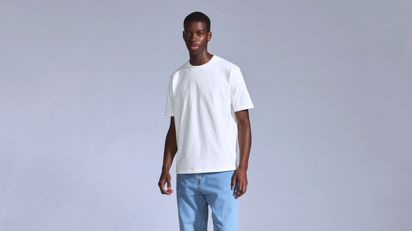 Model wearing white Levi's t-shirt and light blue jeans