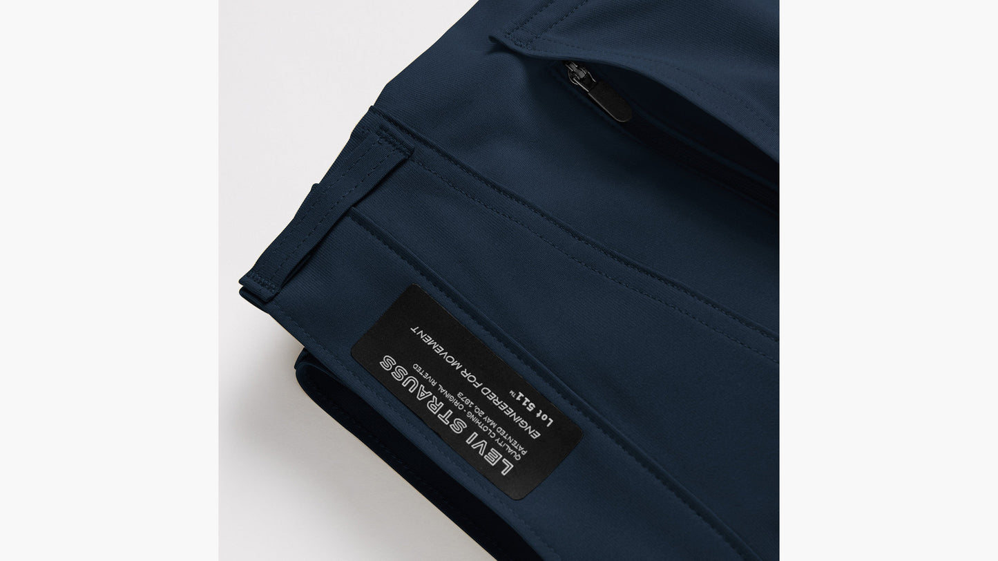 Close-up of Levi’s navy tech pant with zip pocket and logo patch
