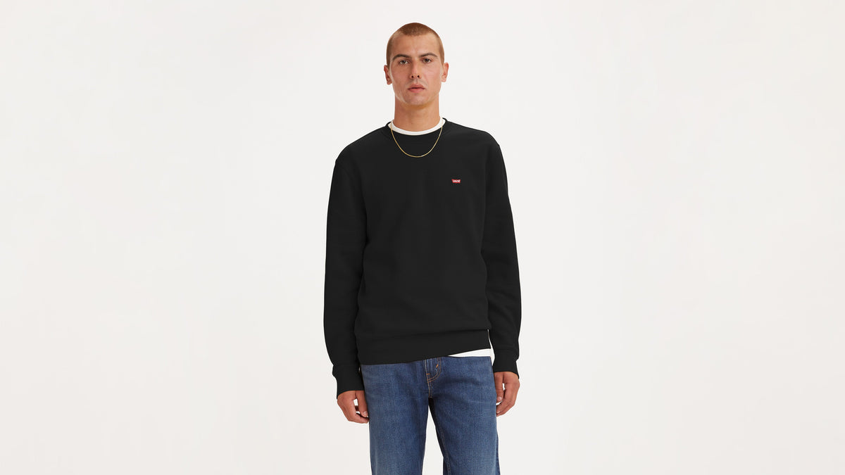 Front view of man in black Crewneck Sweatshirt with Levi's logo and jeans