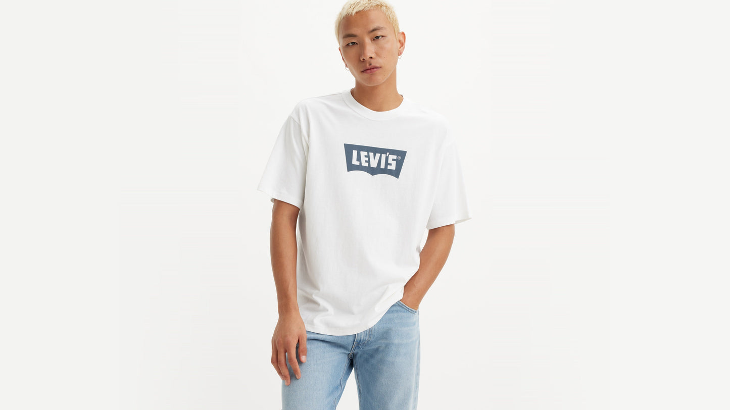 Man in Levi's White Vintage Batwing Graphic T-Shirt with light jeans, front view