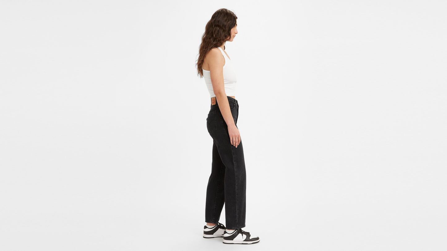 Model in Levi’s women’s 94 Baggy Jeans, side view in blue denim