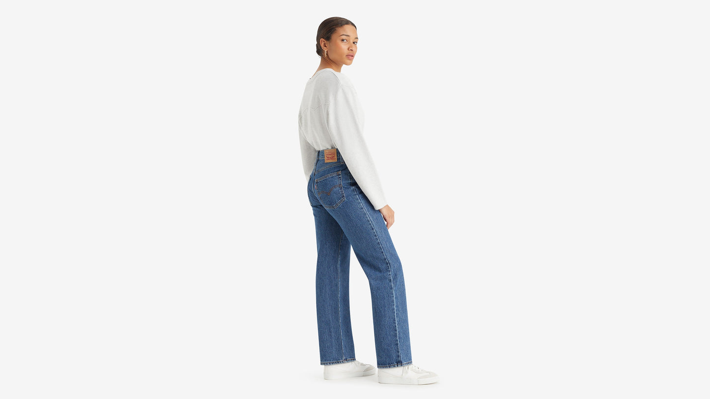 Side view of woman in Levi's 94 Baggy jeans and sweater