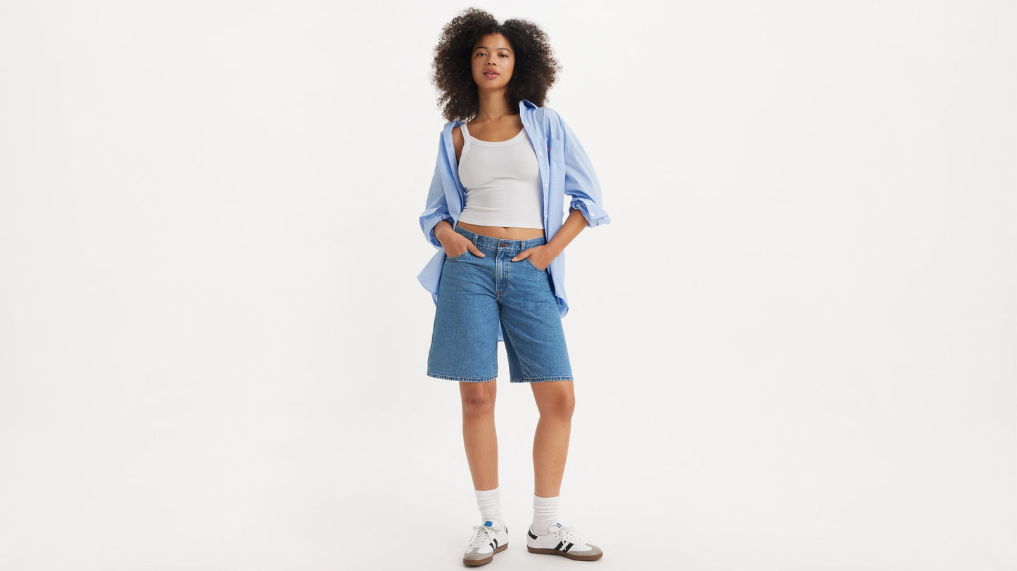 Front view of Levi's polo shirt and shorts on model
