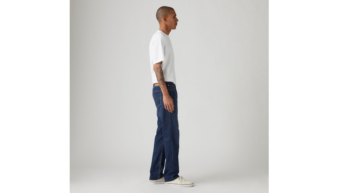 Side profile of man in dark blue Levi's jeans
