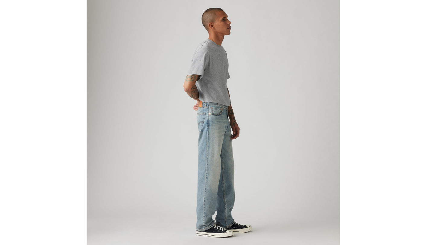 Man in Levi's grey tee and light-blue jeans