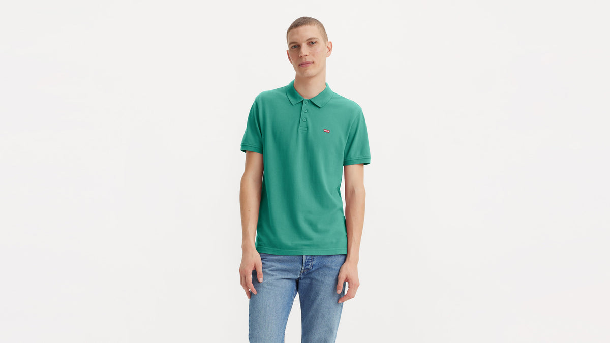 Levi’s green housemark polo styled with denim, worn by male model