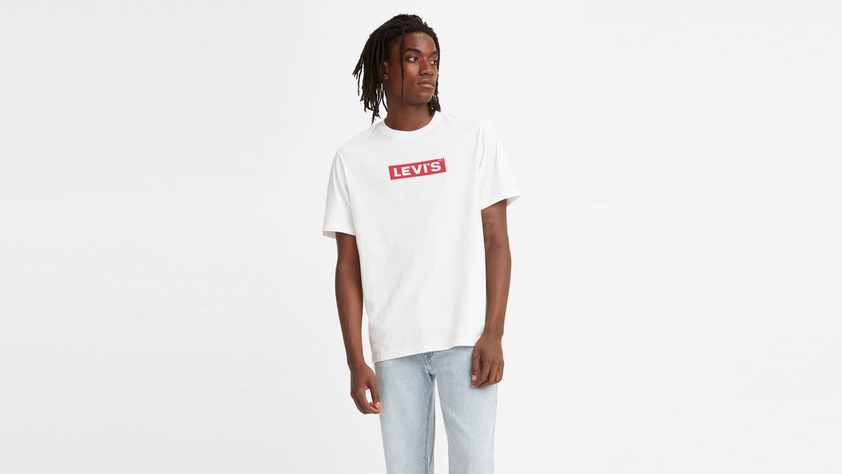 Front view of man in white Levi’s Relaxed Fit Graphic T-Shirt and light jeans