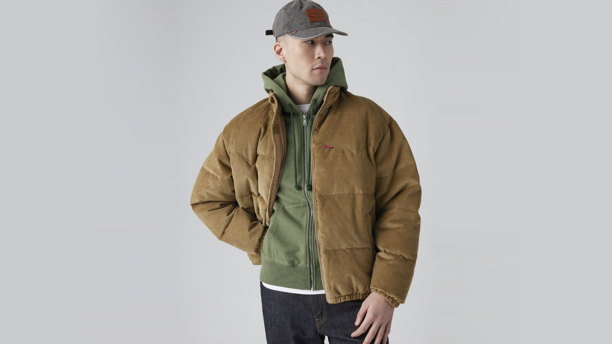 Man wearing Levi's Super Puffer Jacket in tan corduroy