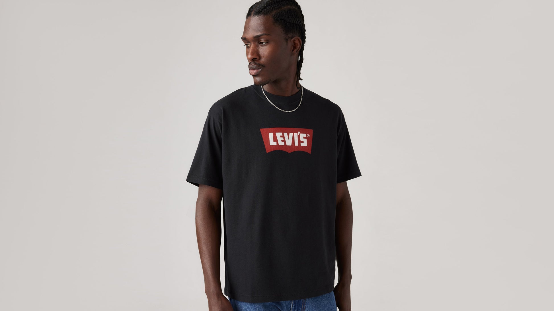 Front view of Levi's black vintage batwing graphic t-shirt styled with jeans