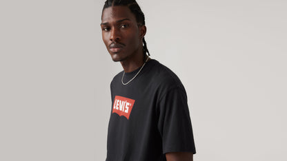 Close-up view of man in black Levi's Vintage Batwing Graphic Tee