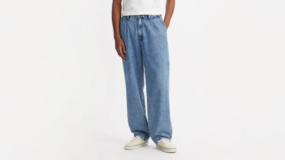 Close-up of Chino Loose Straight pants and white sneakers, front view