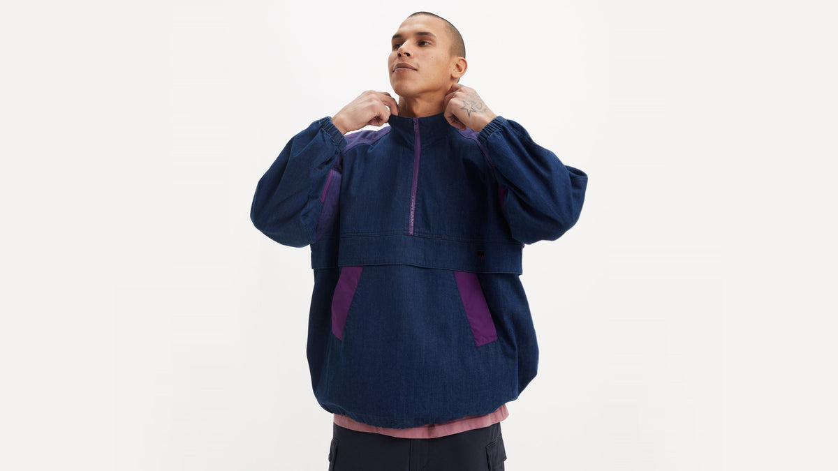 Man in dark denim Levi's anorak with violet pocket details