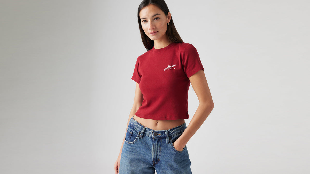 Person in a red cropped Levi's t-shirt with logo detail