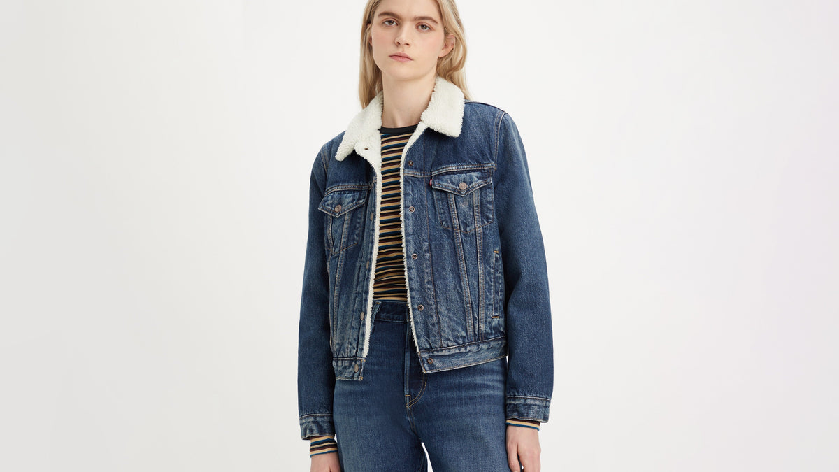 Woman in Levi’s Sherpa denim jacket over striped top