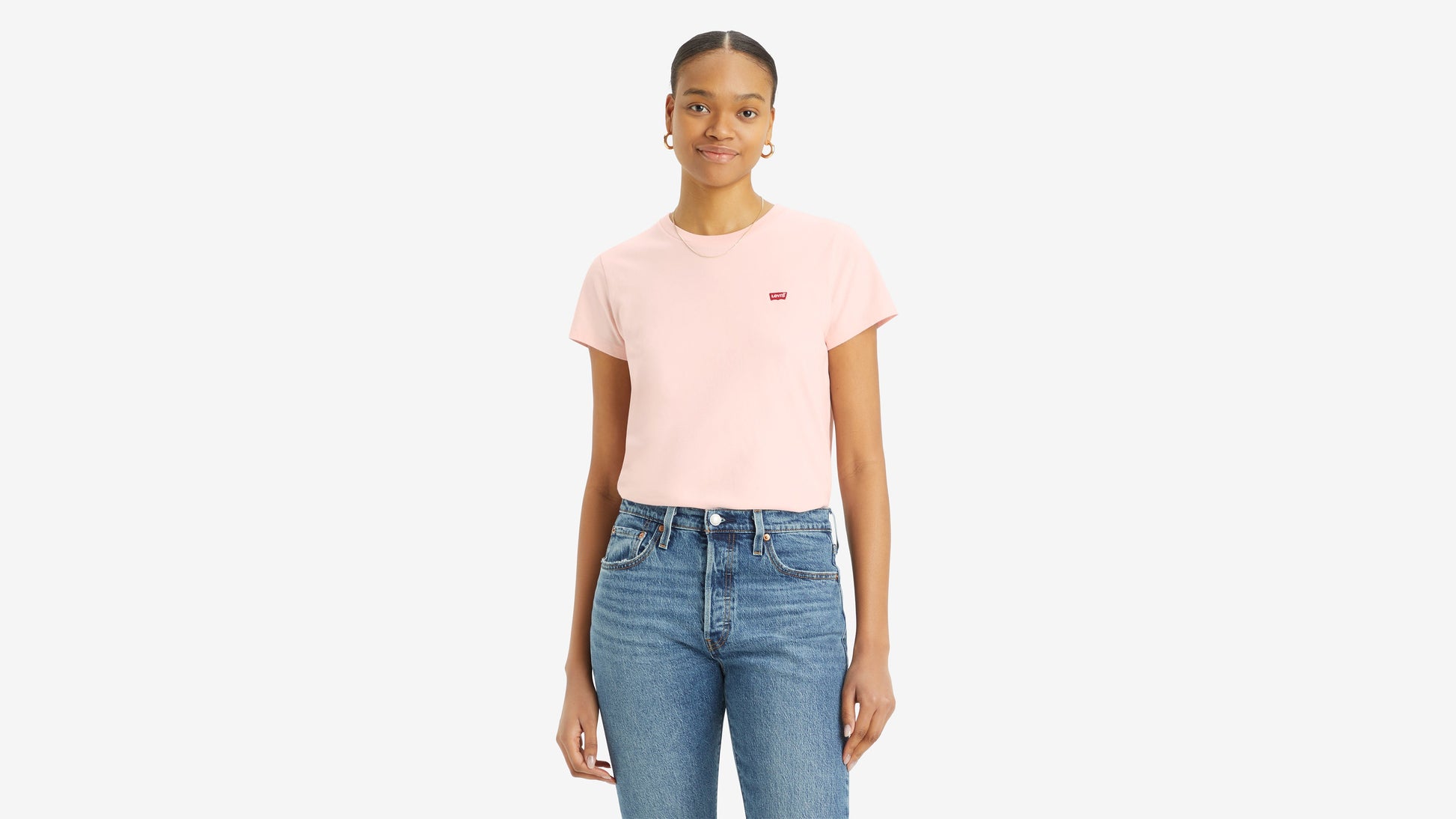 Woman in pink Levi’s t-shirt and blue jeans