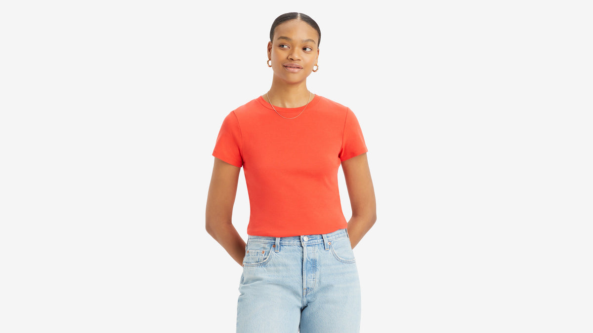 Front view of woman in red Levi's Perfect tee & light-wash high-rise jeans