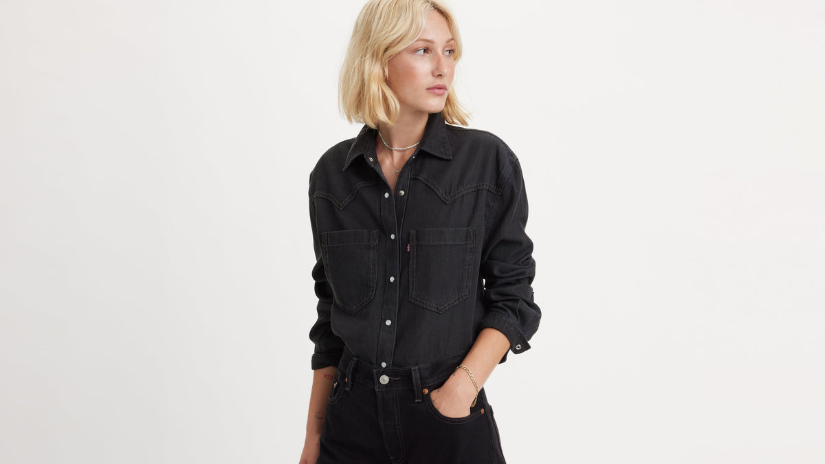 Woman in black Levi’s denim shirt and jeans